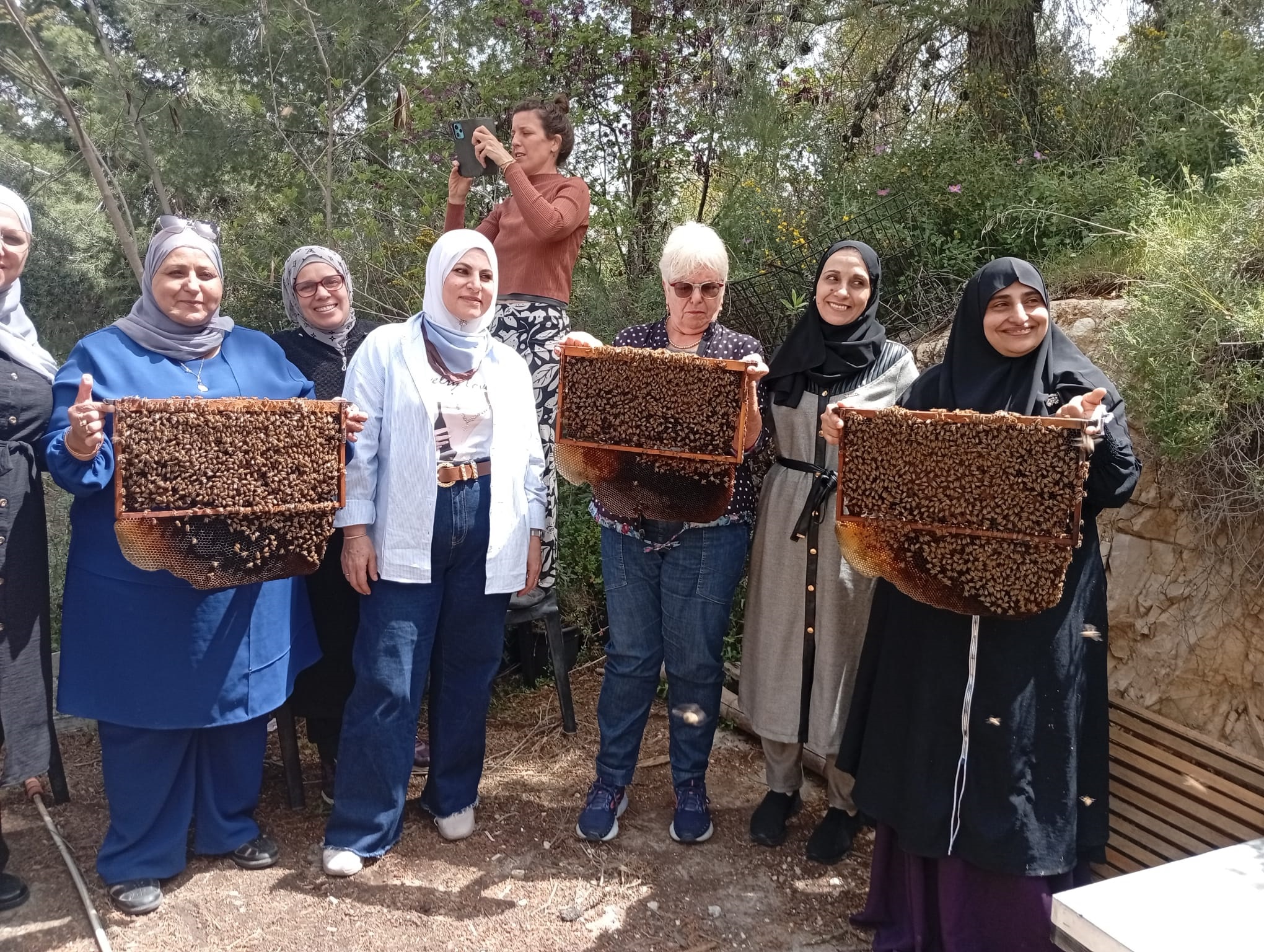 Courage Women holding the frames